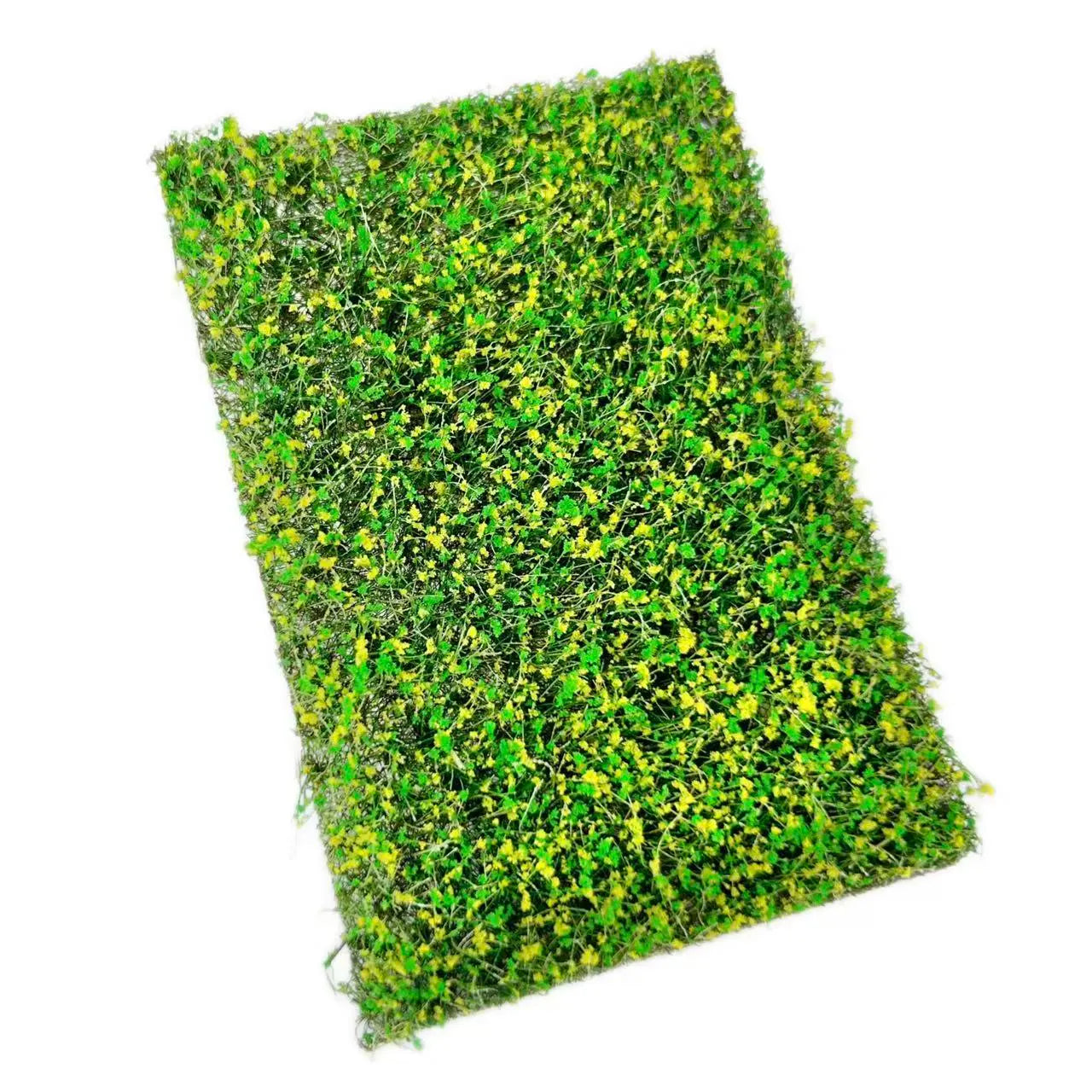 Rectangular artificial miniature grass mat with thick green base and tiny bright yellow flowers, top full view for DIY diorama micro landscape terrain model making