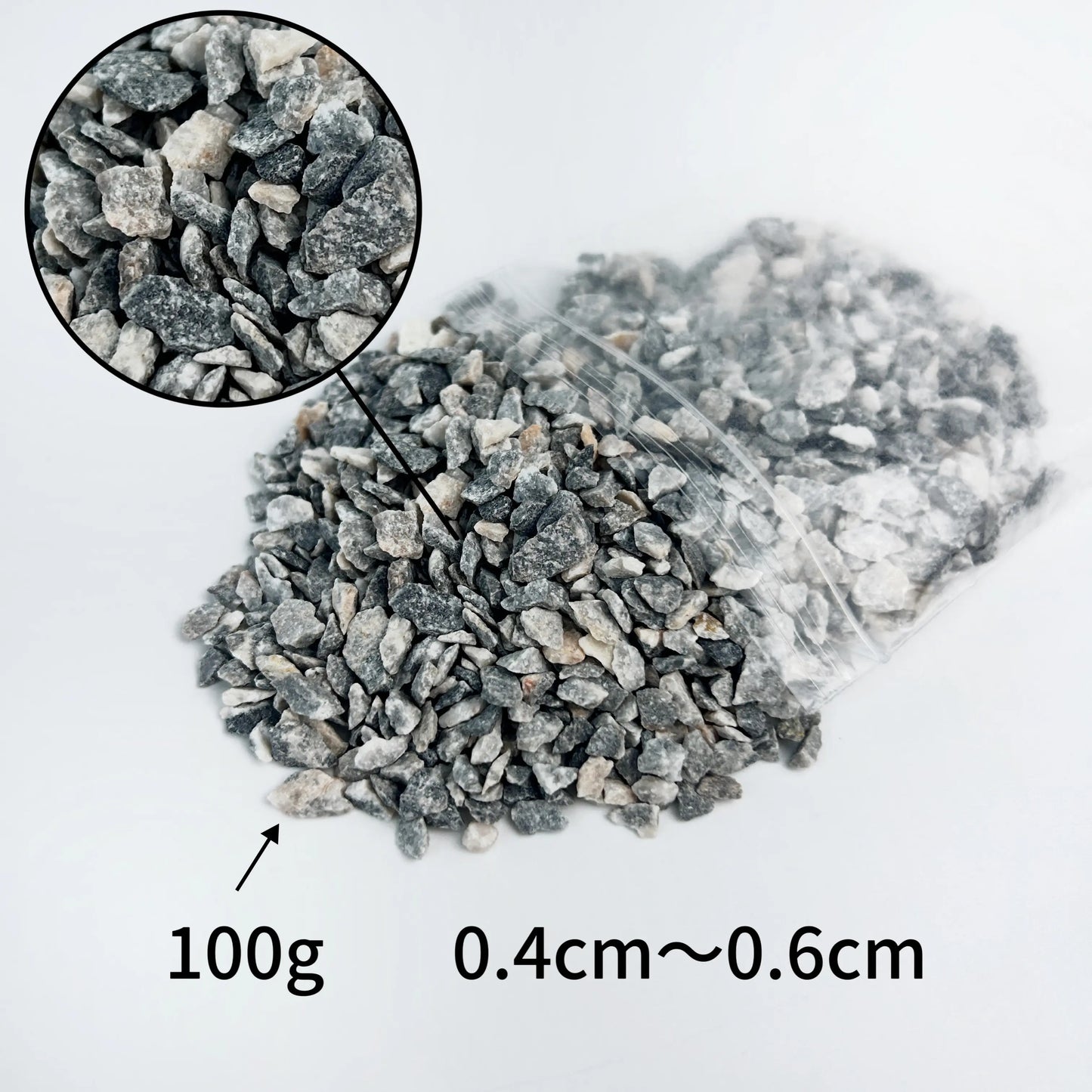 HO scale train model sit on track paved with realistic grey ballast gravel