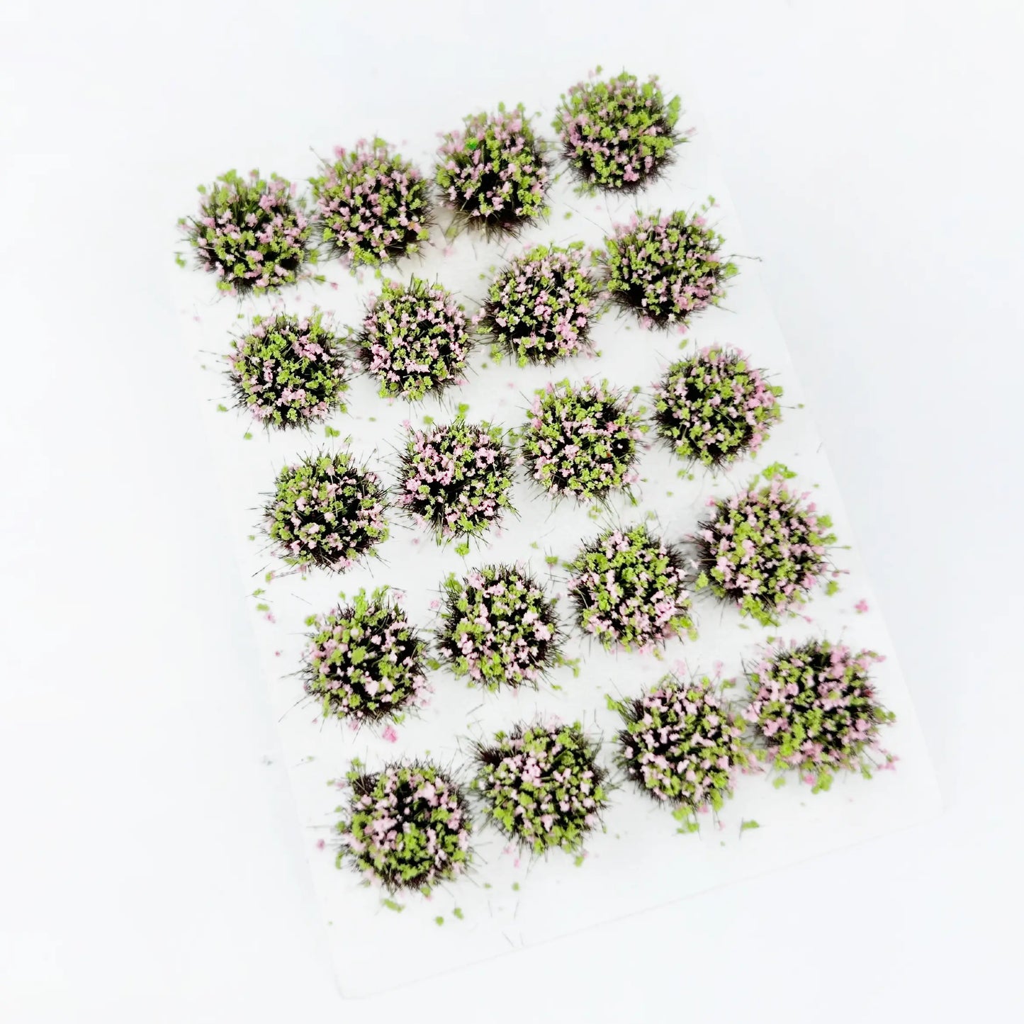 Soft pale green round self-adhesive static grass tuft sheet with delicate light pink wild flower clusters, romantic garden mini foliage clumps for cottage diorama base, fantasy wargame terrain and HO/N scale model railroad landscaping craft