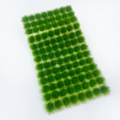 Mixed color pack of 104 self-adhesive static grass tufts sheets, includes dry brown, autumn yellow, light green, forest green, deep green and bright green, packed in transparent plastic storage box, static grass tufts, miniature diorama supplies, wargame terrain material, model railway grass, self-adhesive grass clusters, scale model scenery, warhammer terrain, hobby craft grass