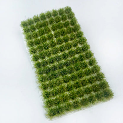 Pack of 104 self-adhesive static grass tufts sheet, 10.8cmx6cm overall size with medium forest green mini foliage clumps, close-up detail display, static grass tufts, miniature diorama supplies, wargame terrain material, model railway grass, self-adhesive grass clusters, scale model scenery, warhammer terrain, hobby craft grass