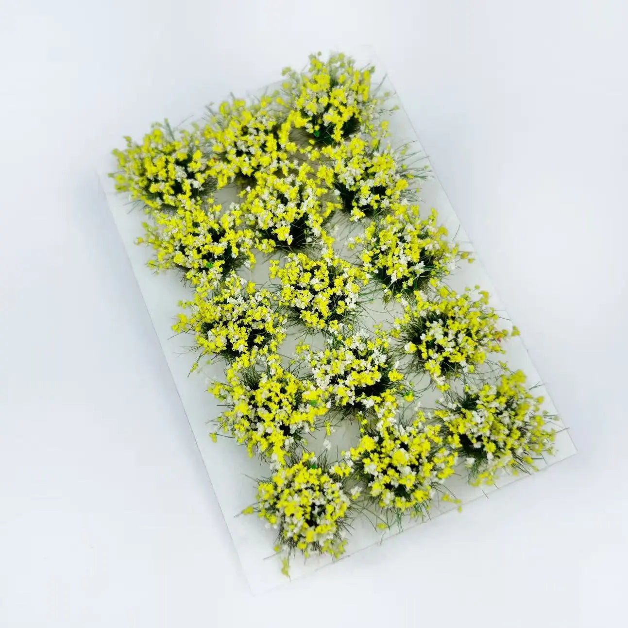 15 vibrant static grass with flower clusters, miniature battlefield decoration, shallow depth of field