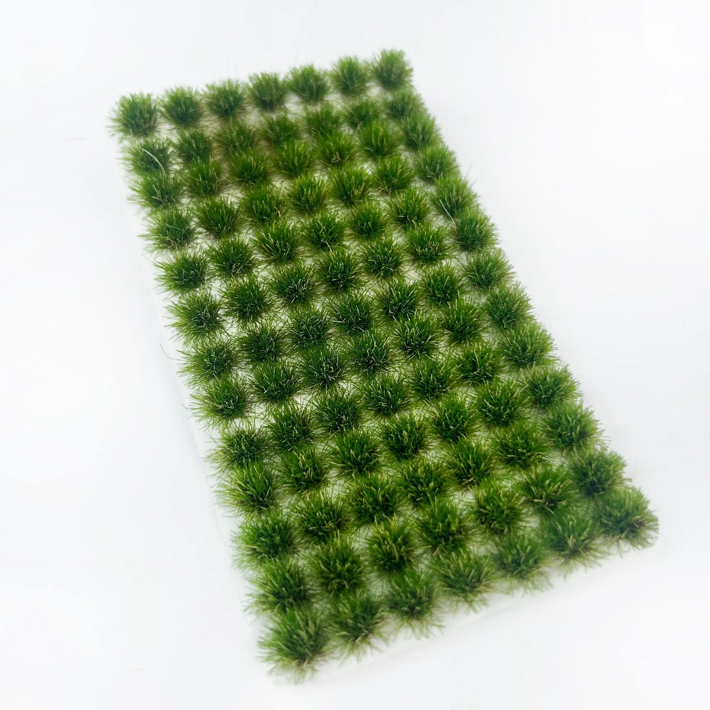 Olive autumn green mixed pale dry yellow static tuft grass sheet, natural faded seasonal grass texture, versatile model terrain mat for grassland, hills and outdoor wargame diorama scene
