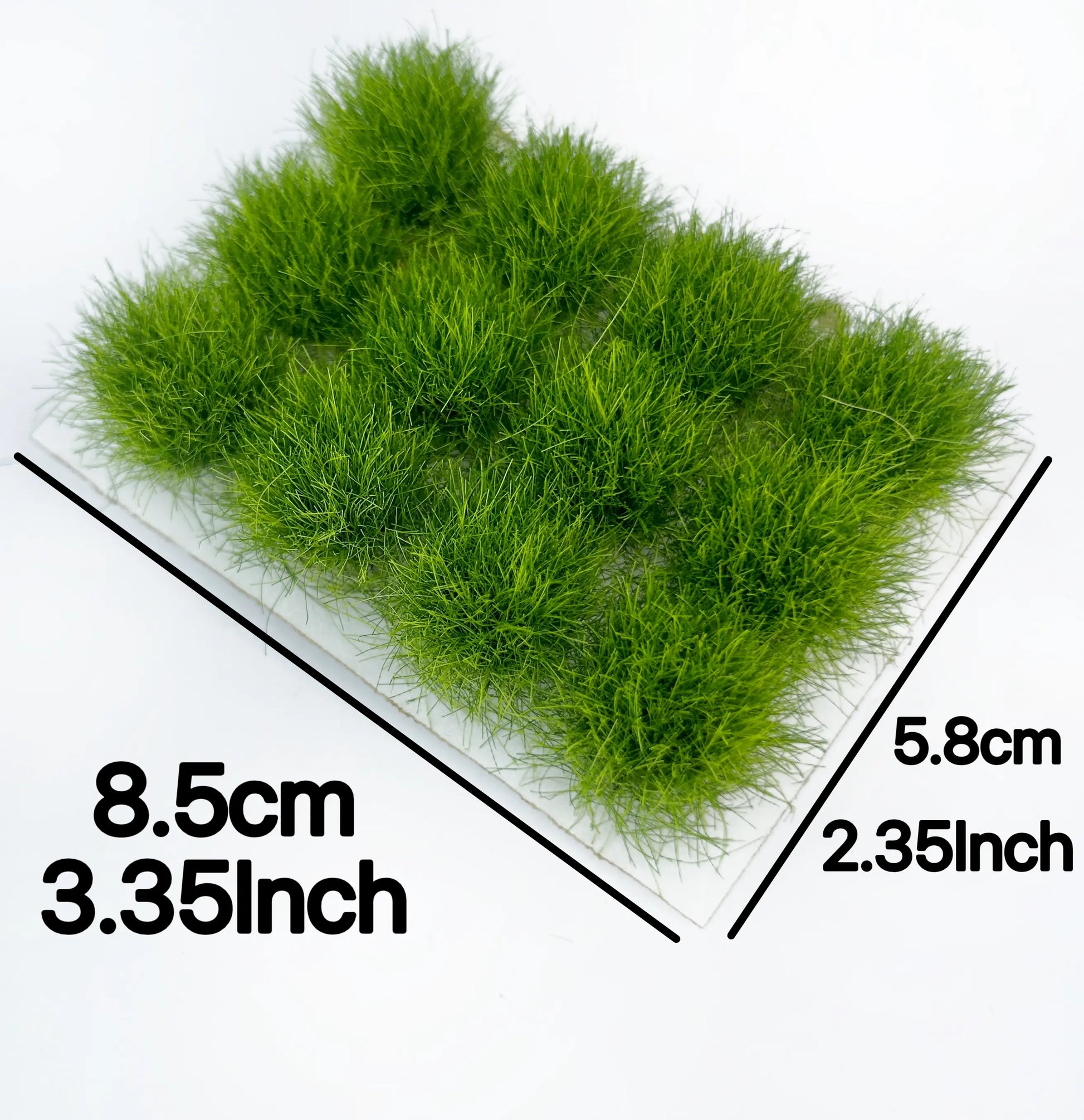 Self-adhesive bright green miniature grass tuft mat printed with 8.5cm × 5.8cm size measurements, for diorama and wargame micro landscape craft reference