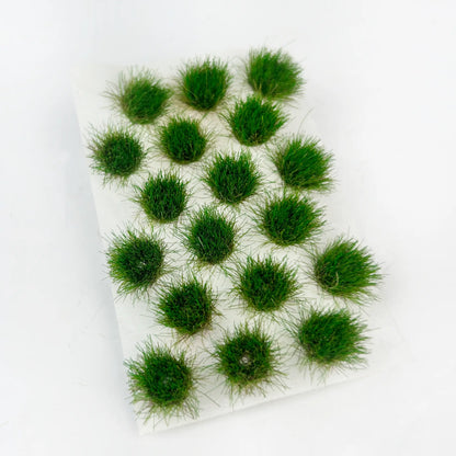 Deep dark emerald green round static grass tuft sticker sheet, dense shaded mini grass clusters for shadowed forest diorama, wargame mini base and scale railway model landscape craft
