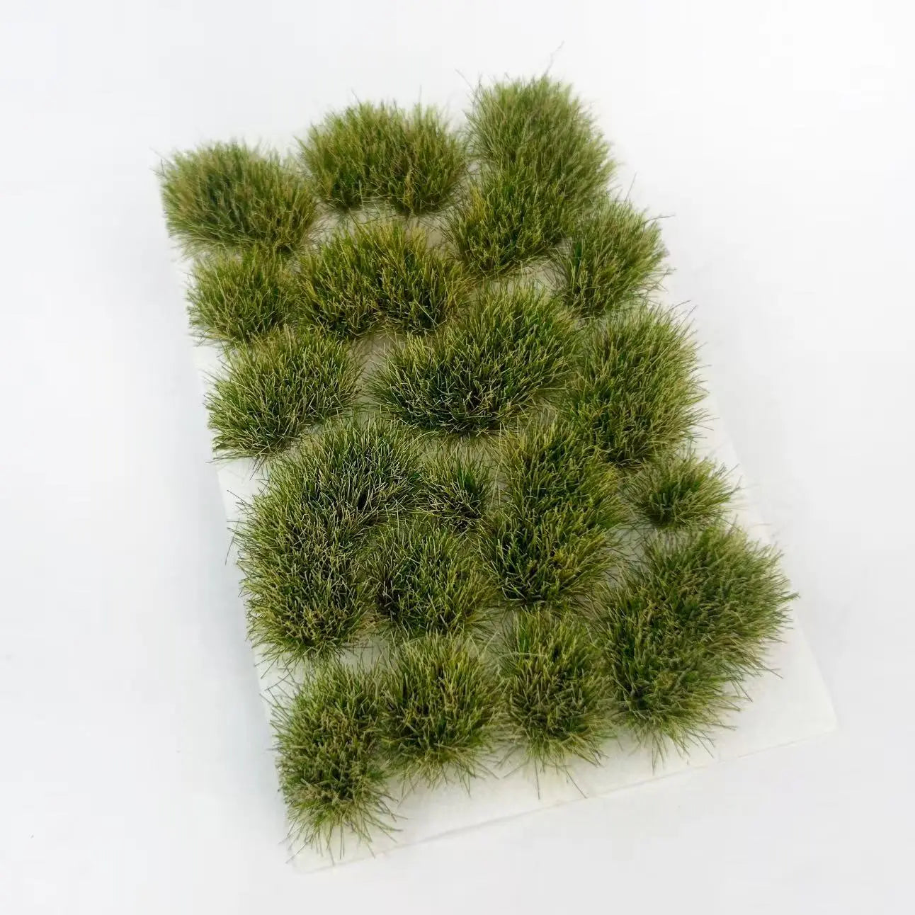 Mixed summer green irregular static grass tufts, fluffy low-shed grass fiber, self-adhesive backing for forest, meadow and garden miniature scale model terrain making