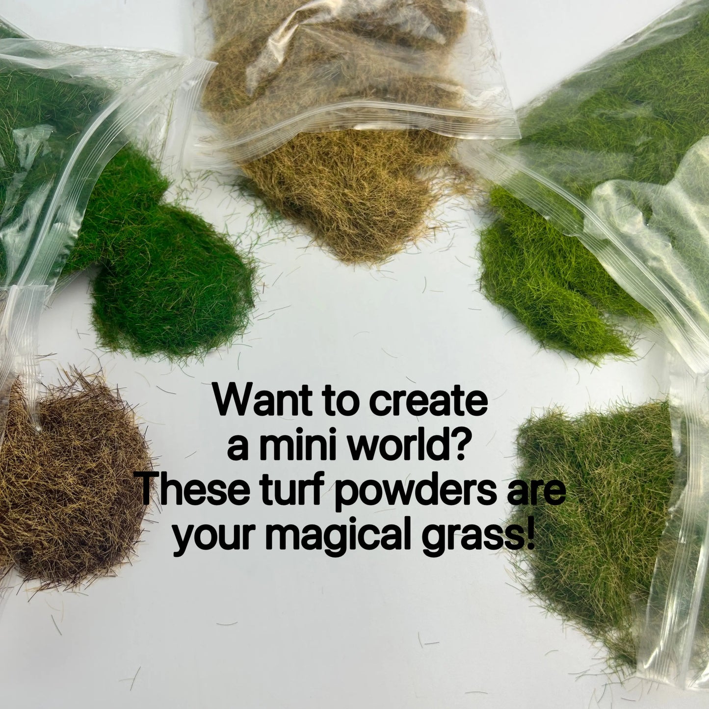 Using tweezers to place 8mm static grass tufts on miniature house diorama terrain