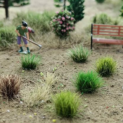 Miniature garden yard finished diorama layout with multi-color static grass tufts, gardening worker figure, park bench and blooming bush, self-stick mini grass clusters for backyard scale model and wargame terrain decoration