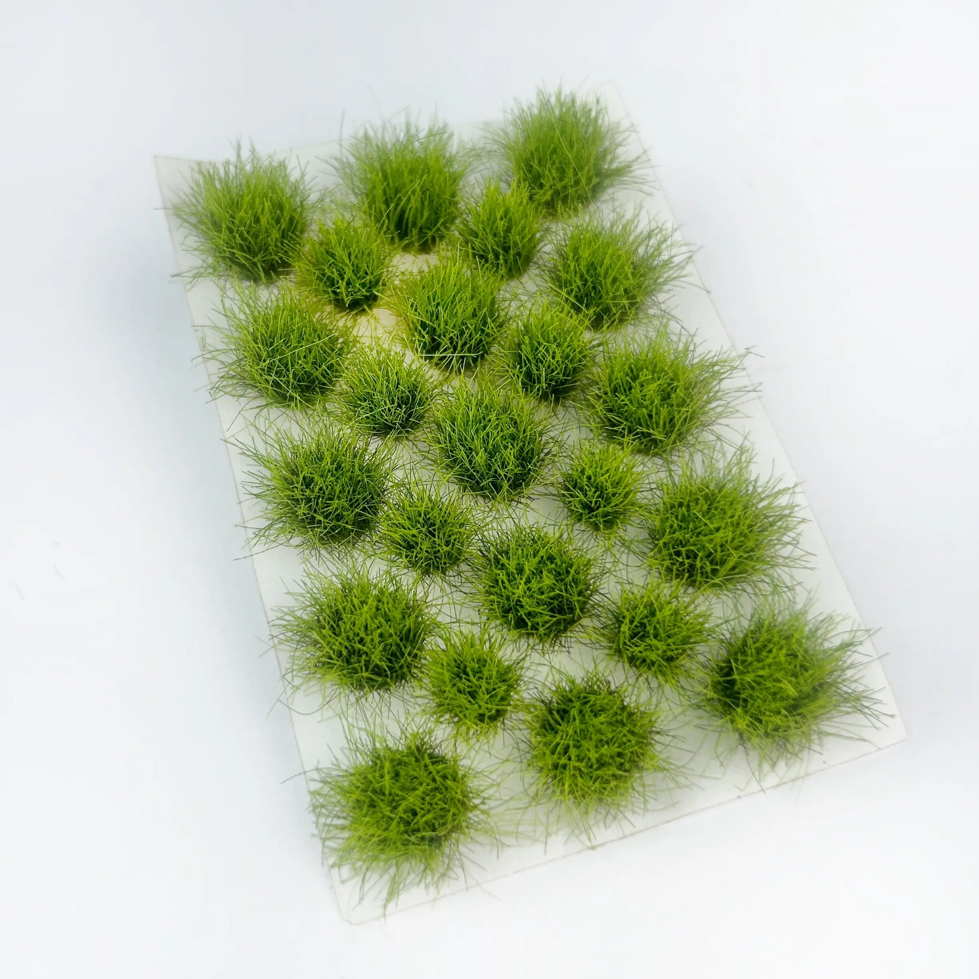 Soft light spring green static grass tuft sheet, pre-placed self-adhesive wild grass clumps, fresh meadow foliage material for scale model diorama, war game terrain, railroad layout hobby craft
