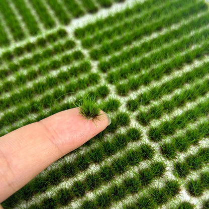Close-up of dense green static grass tufts for miniature landscapes and dioramas