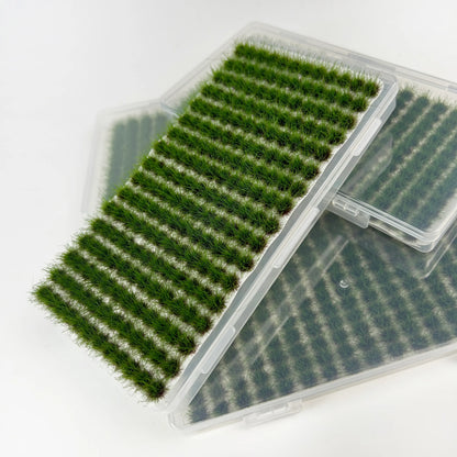 Individual green grass tuft lifted from the sheet for easy placement on miniature scenery