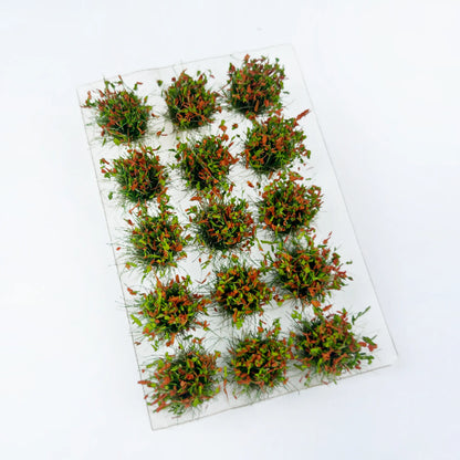 Mixed green and orange seasonal static grass tuft sheet, transitional spring-autumn mini grass clumps for countryside diorama, tabletop game terrain and scale model making
