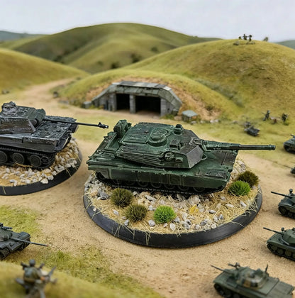 Completed military tank battle diorama terrain scene with realistic static grass tufts laid on tank bases, rolling grassy hills, bunker shelter and mini soldier figures, showcase of self-adhesive grass clusters for wargame scale model landscaping