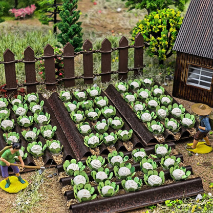 Backyard farm diorama with miniature cabbage crop trays, wooden fence and farmer figure for wargame terrain creation