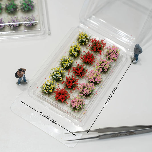 Mixed color miniature self-adhesive flower tufts in clear plastic blister pack, model diorama scenery supplies for wargame and railway layout
