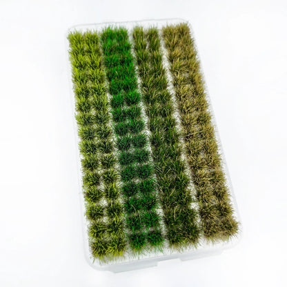 Assorted four-color static grass tufts strip set packed in clear plastic tray, marked with complete size measurements for wargame terrain and diorama miniature landscape crafting reference
