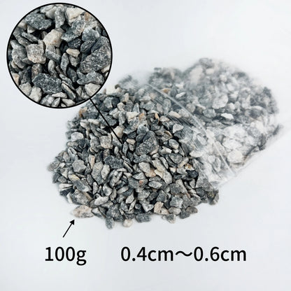 HO scale train model sit on track paved with realistic grey ballast gravel 