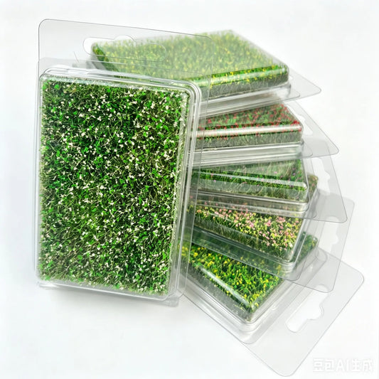 Multi-color pre-made static grass mat blister pack set, green grass with white tiny flower clusters, pink blossom grass sheet, yellow wild foliage mat, self-adhesive miniature terrain grass sheet for diorama, wargame scenery, railway layout, architectural scale model hobby craft supplies