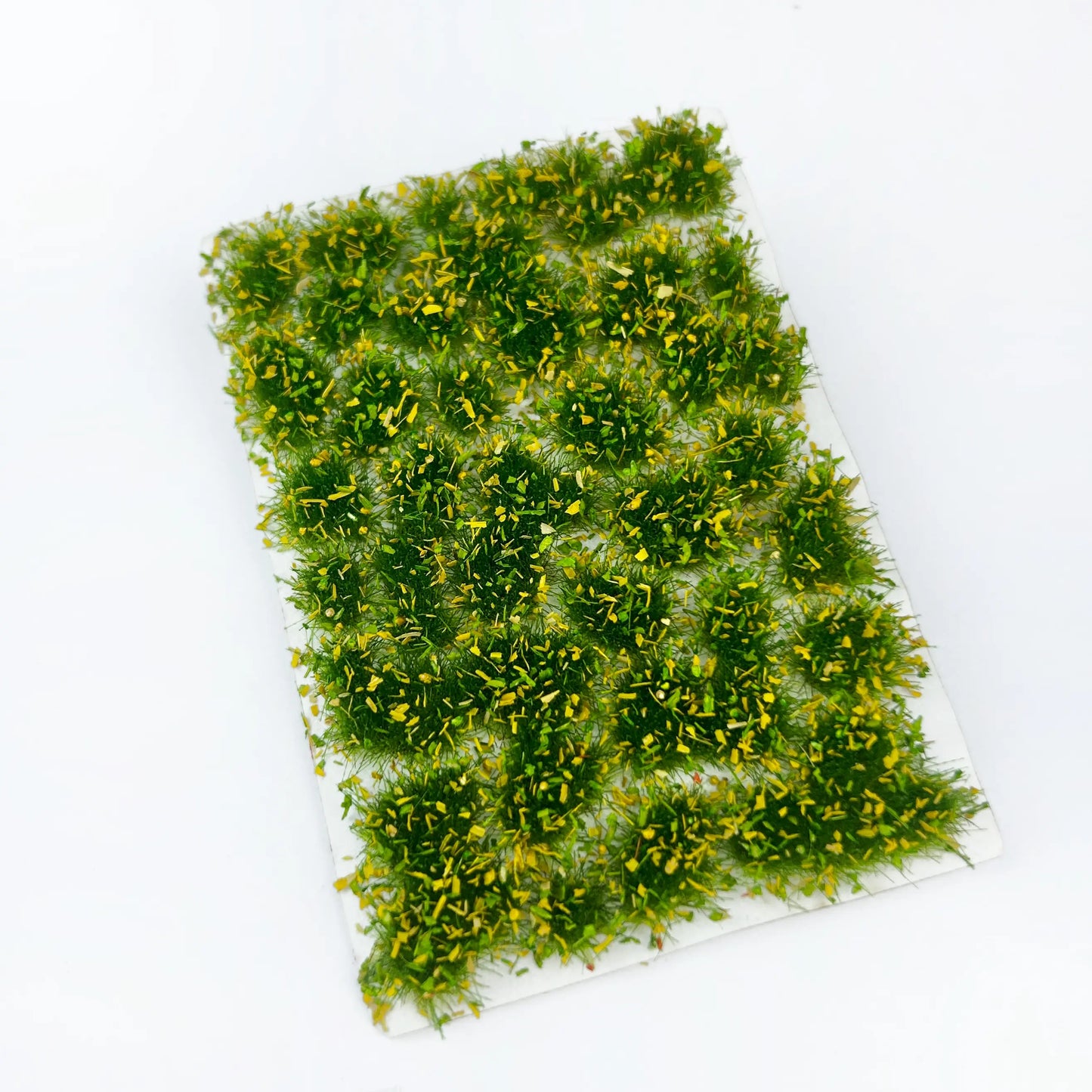 Pre-made pale yellow green gradient spring meadow static grass tufts sheet with scattered yellow grass flecks, realistic static grass mat miniature lawn terrain for scale model building, wargame tabletop base, railway layout scenery and diorama craft hobby supplies