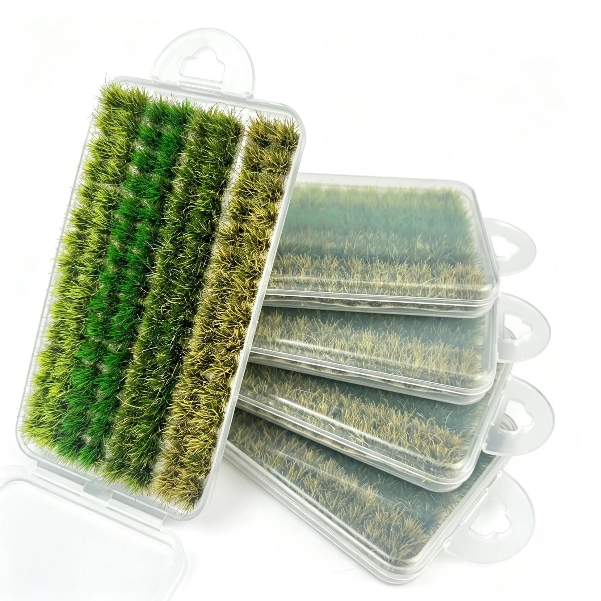 Mixed gradient green miniature static grass tuft set in transparent storage box, multi-shade natural grass clumps for diorama landscape, wargame terrain and model scenery crafting