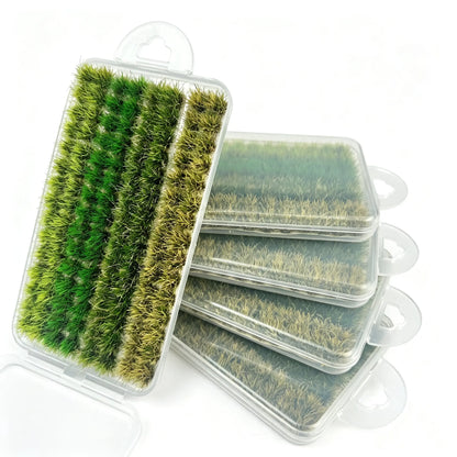 Mixed gradient green miniature static grass tuft set in transparent storage box, multi-shade natural grass clumps for diorama landscape, wargame terrain and model scenery crafting