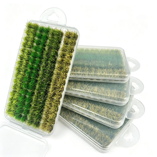 Mixed gradient green miniature static grass tuft set in transparent storage box, multi-shade natural grass clumps for diorama landscape, wargame terrain and model scenery crafting