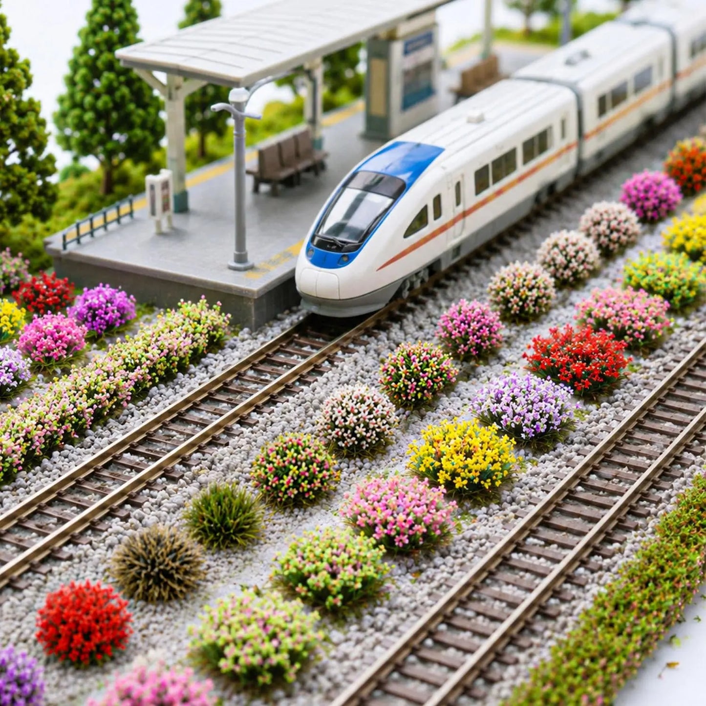 Full color assortment chart of miniature flower bushes, grass tufts and long hedge strips, multiple seasonal tones for custom handmade diorama terrain projects