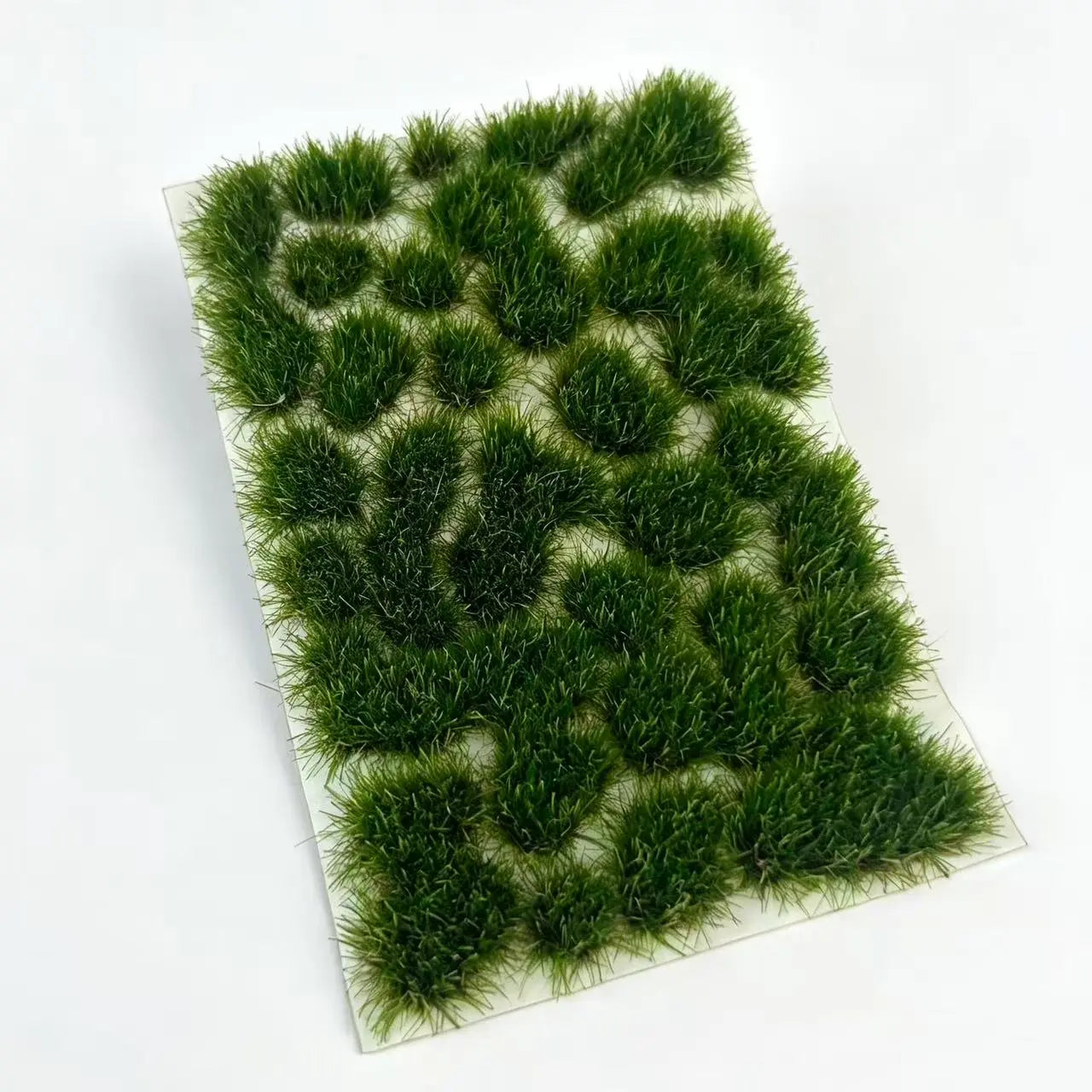 Size marked static grass tuft sheet 8.5cm × 5.8cm, contains 29 irregular mixed shape self-adhesive grass clusters, light spring green miniature terrain grass for all scale model hobby creation