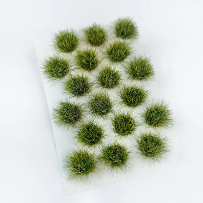 Soft olive green self-adhesive round static grass tuft sheet, mini woodland foliage clumps for forest diorama base, tabletop wargame terrain and HO/N scale model railroad landscaping supplies