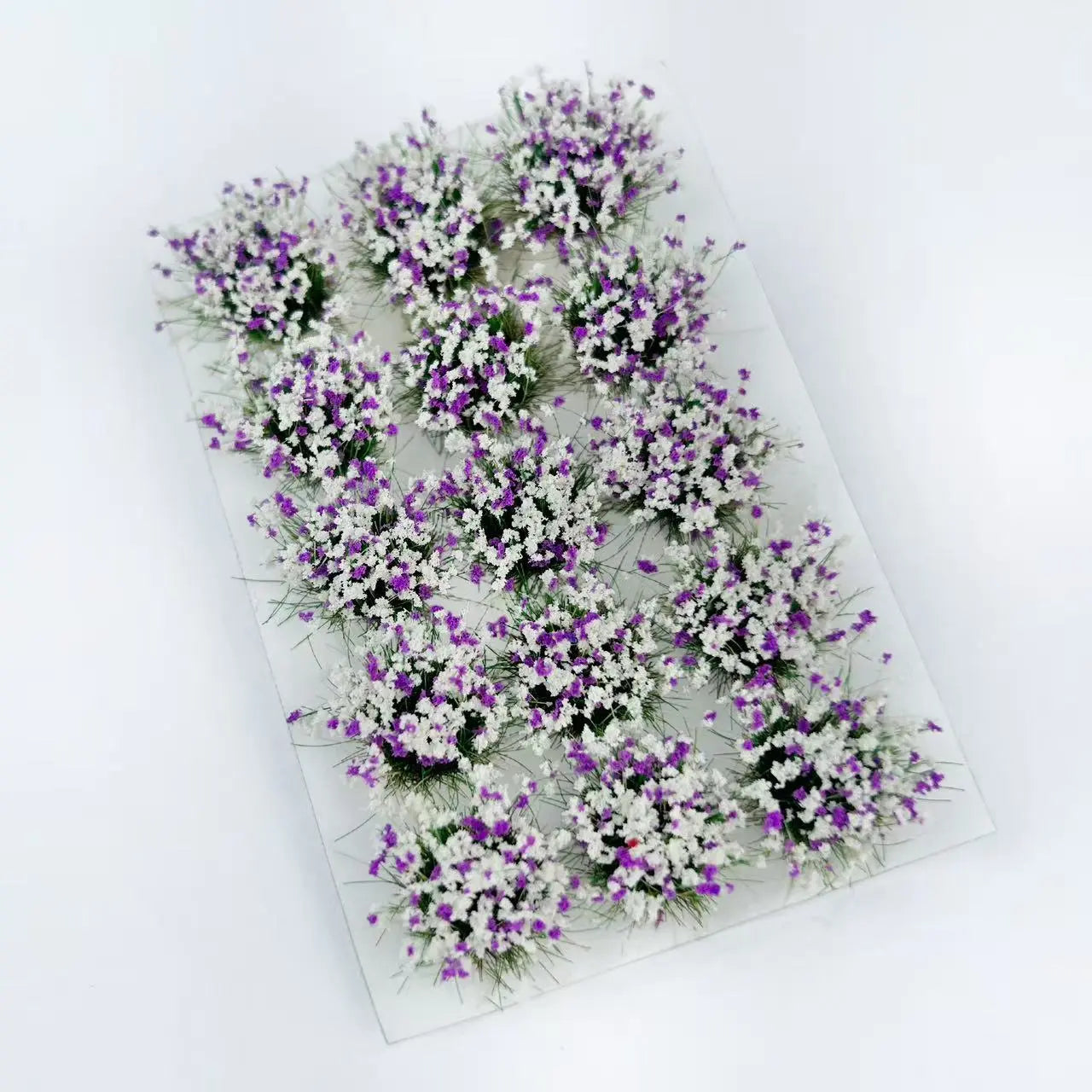 15 vivid flower grass tufts, hobby terrain accessory, detailed floret clusters, e-commerce render