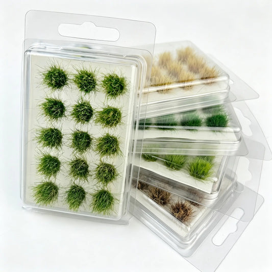  Self-adhesive round static grass tufts assortment, multiple green & autumn brown shades, stacked blister hanging boxes, solid white background, commercial e-commerce product photo, soft studio light, ultra detailed fine grass fibers