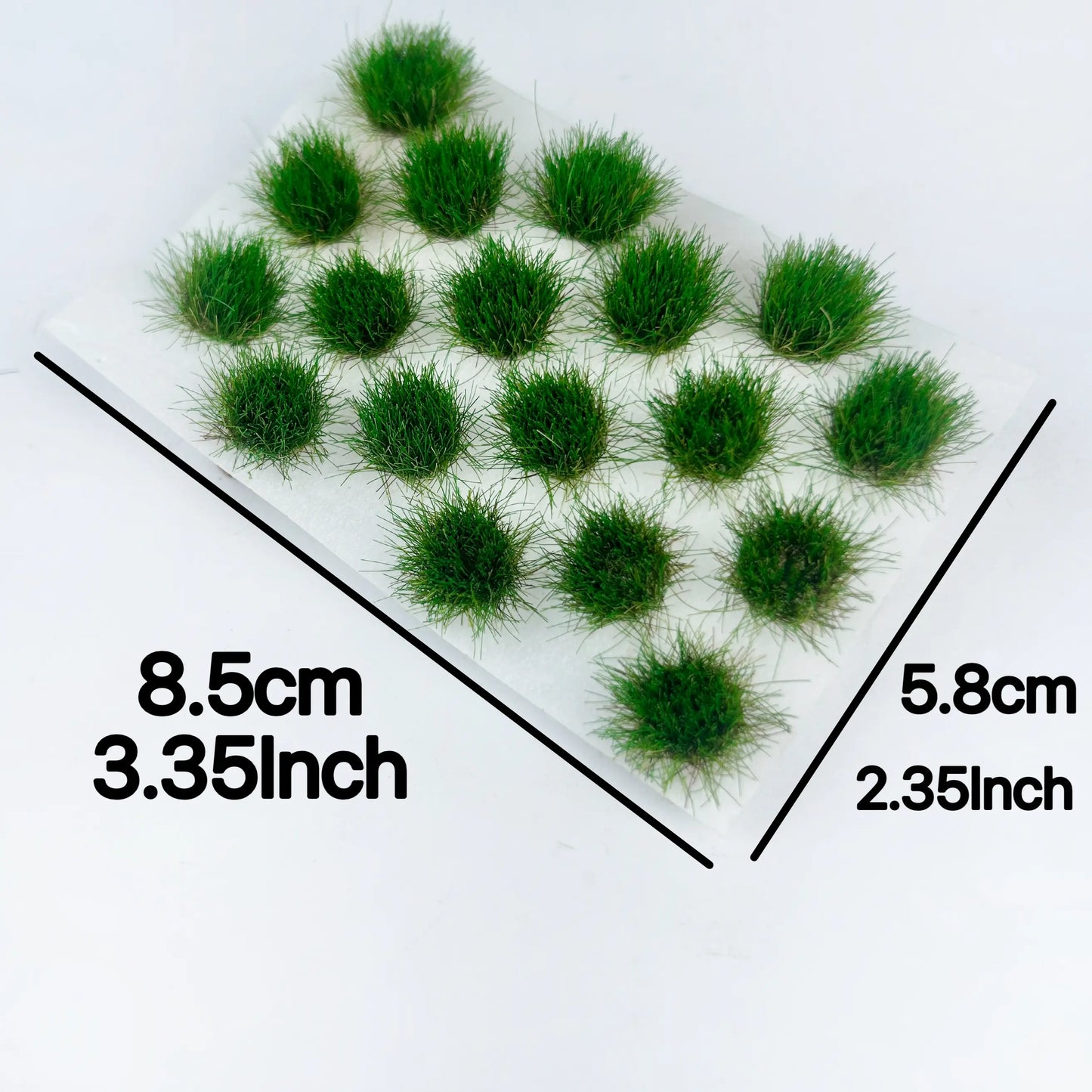 Dimension reference chart for self-adhesive round static grass tuft sheet, measured 8.5cm x 5.8cm (3.35in x 2.35in), multi-color miniature grass clump size display for scale model hobby crafters