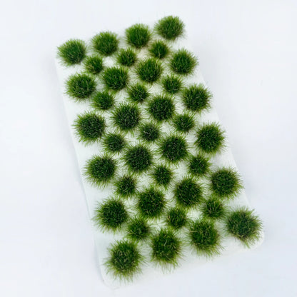 Self-adhesive spring light green static tuft grass sheet with subtle pale white fine grass tips, premium miniature terrain landscaping material for military diorama, wargame base and scale model scene making