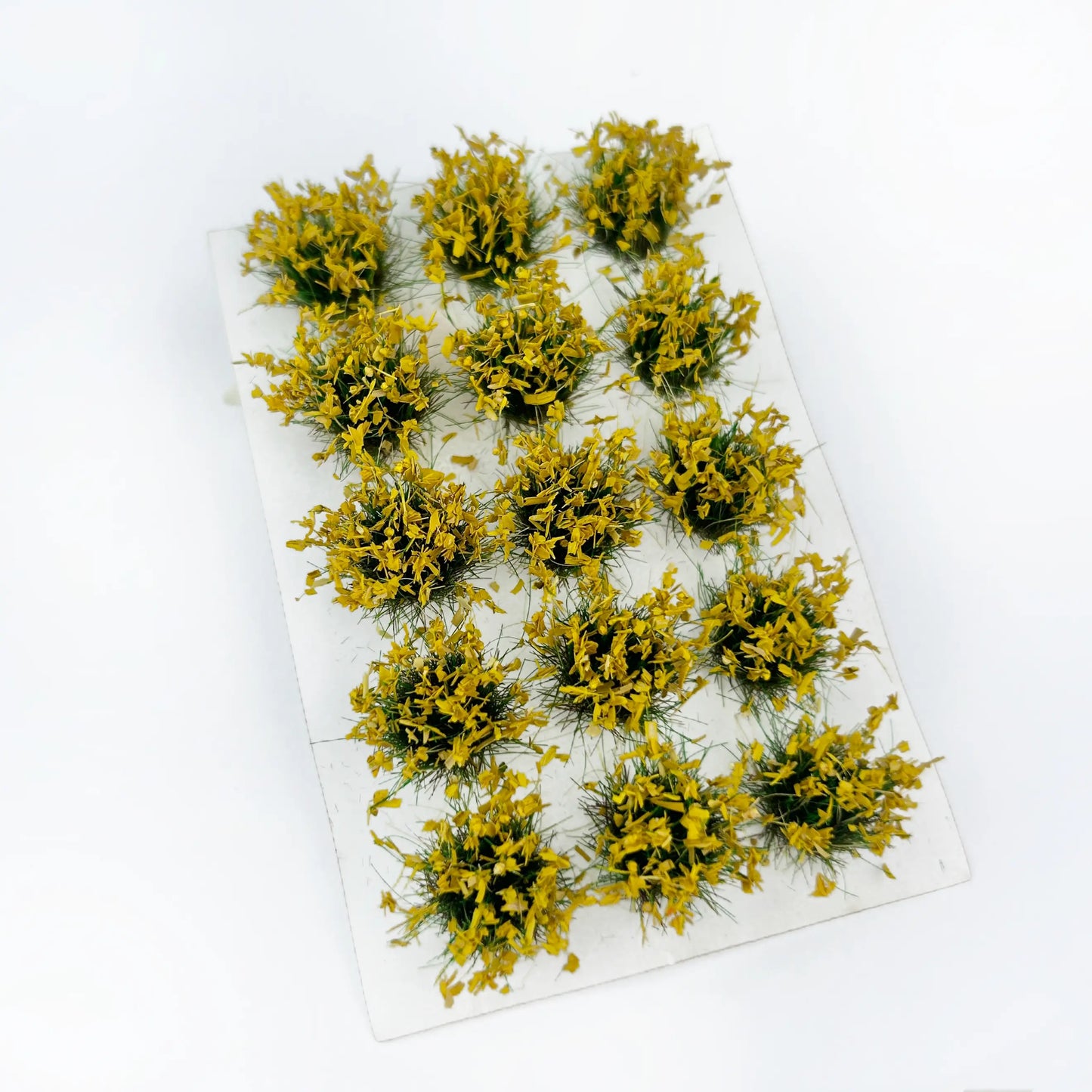 Vibrant solid yellow static grass tuft sheet, uniform warm tone miniature grass patches for autumn field diorama, warhammer terrain and architectural model decoration
