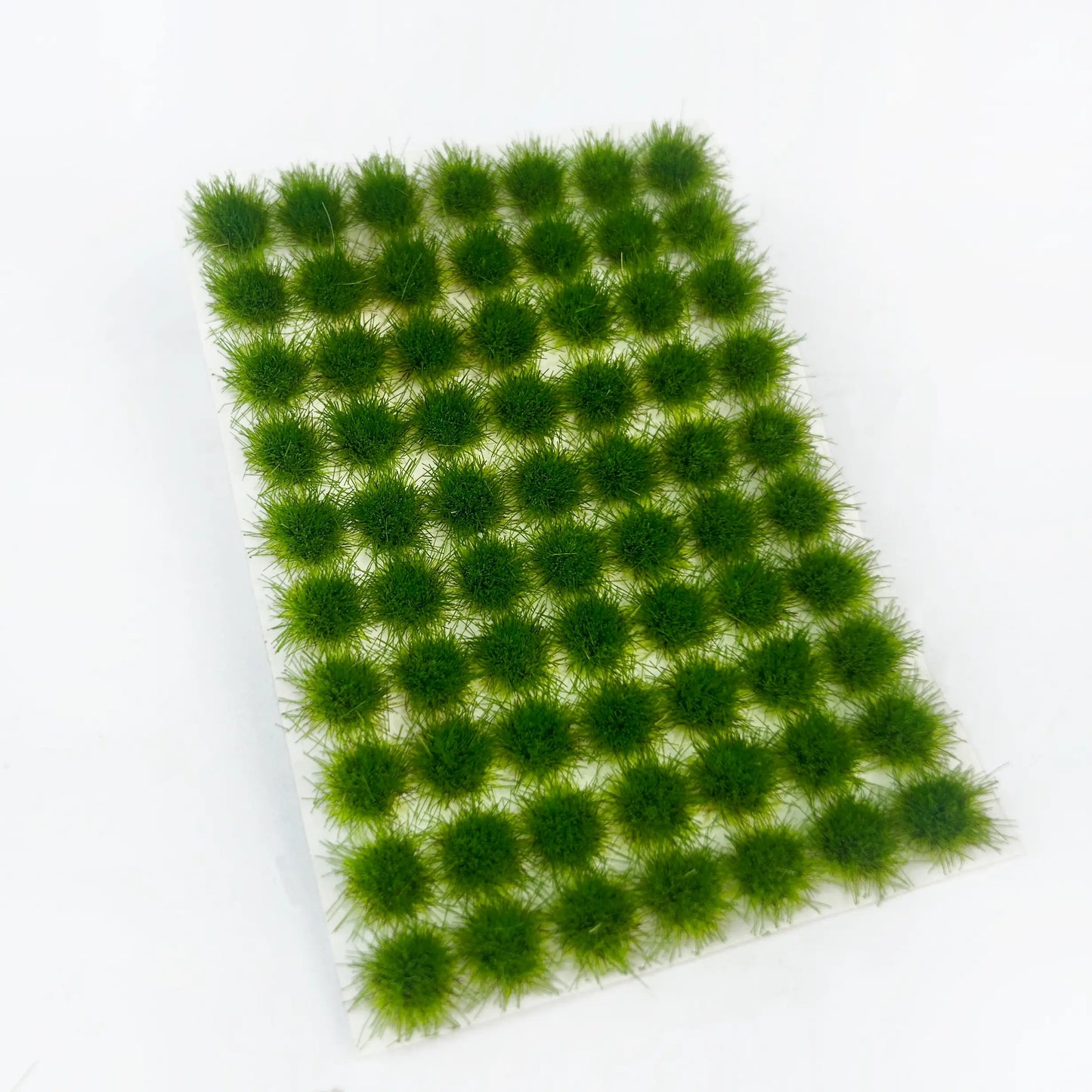 Self-adhesive vivid spring green miniature grass tuft mat with full size measurements marked, for fresh natural countryside diorama and wargame terrain craft reference