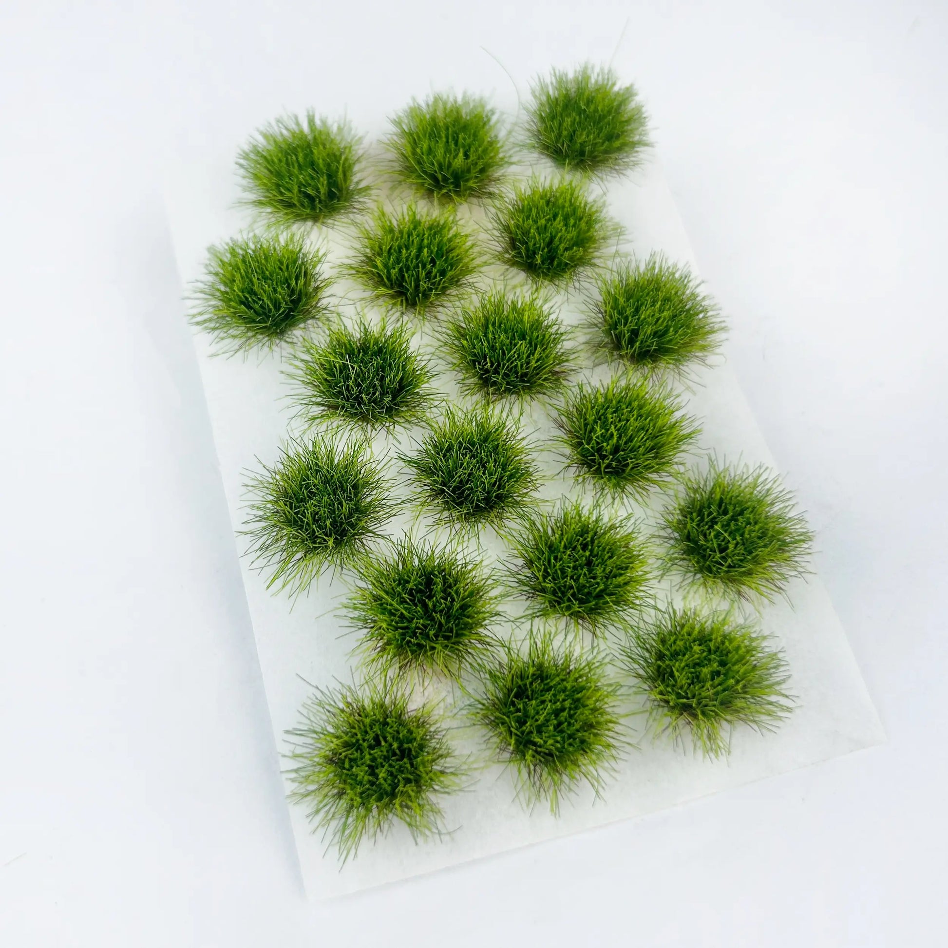 Vibrant fresh lush green self-adhesive static grass tuft sheet, bright spring mini foliage clumps for woodland diorama layout, sci-fi & fantasy tabletop wargame terrain and train model scenery