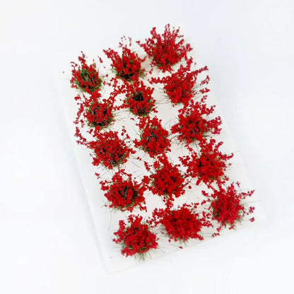  15 small grass clumps with tiny flowers, 1:64 scale scenery parts, pure white backdrop, high resolution
