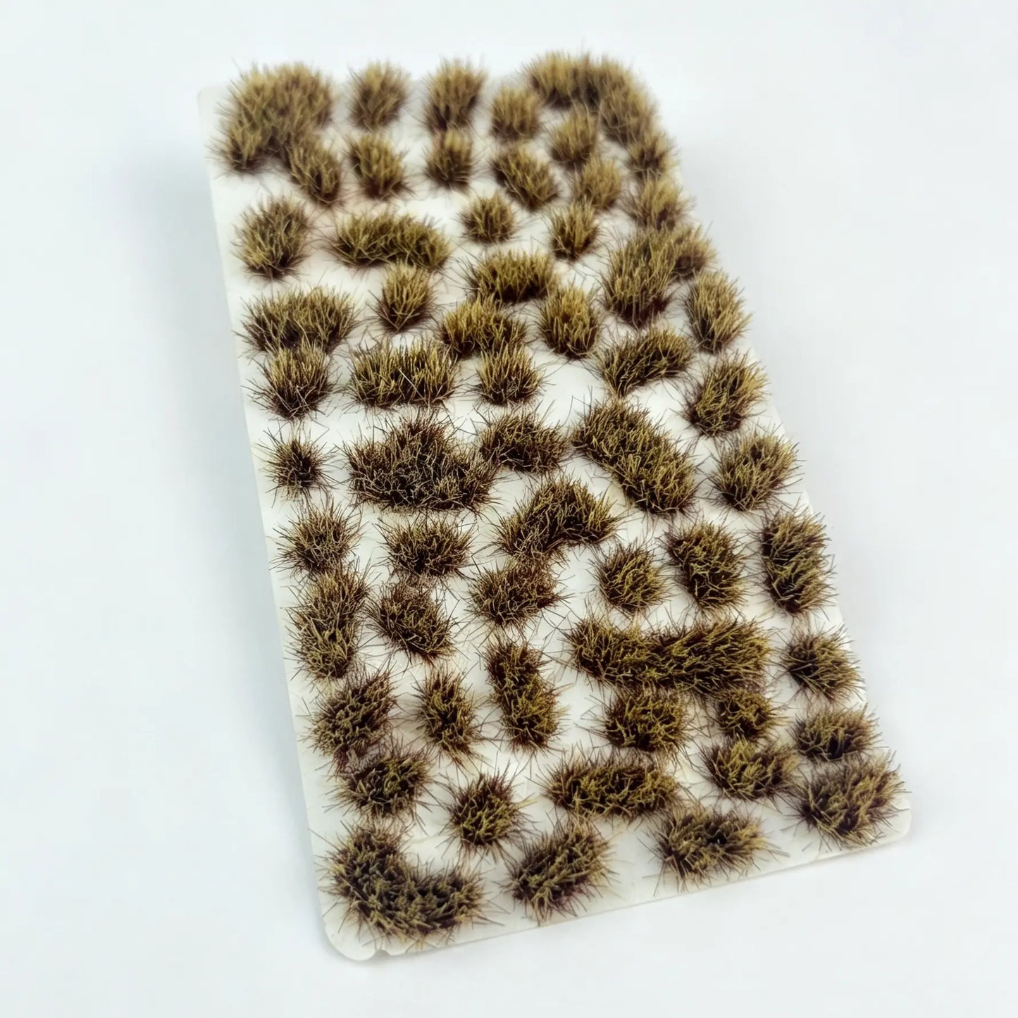  Wargame battle diorama terrain decorated with mixed green and brown static grass tufts, military miniature scenery
